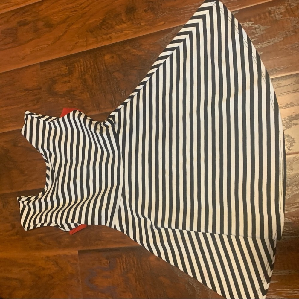 White and black dress with red bow on the back